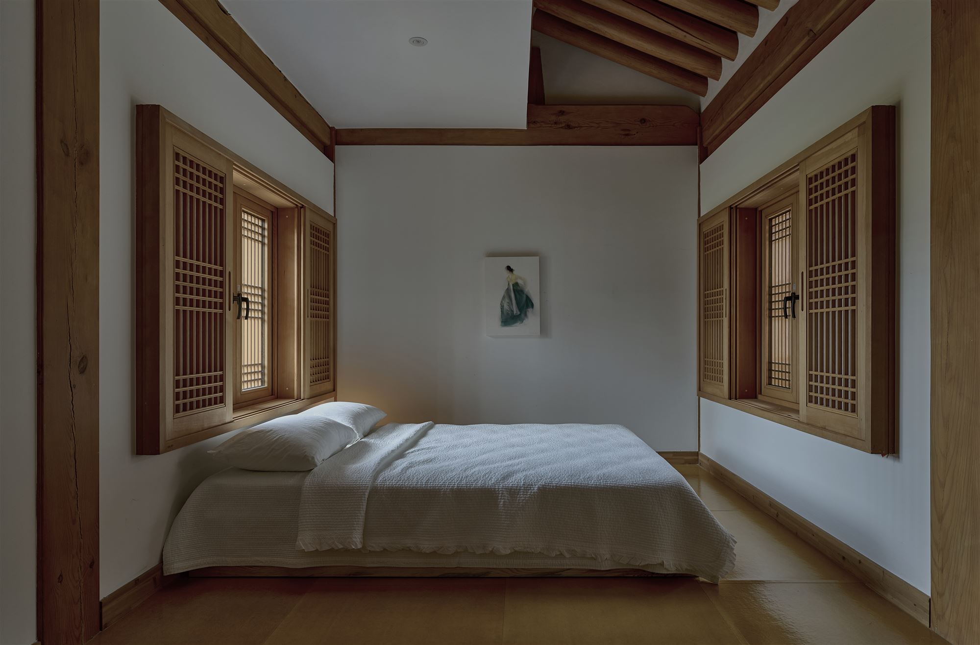 The bedroom in the evening, glowing with soft light