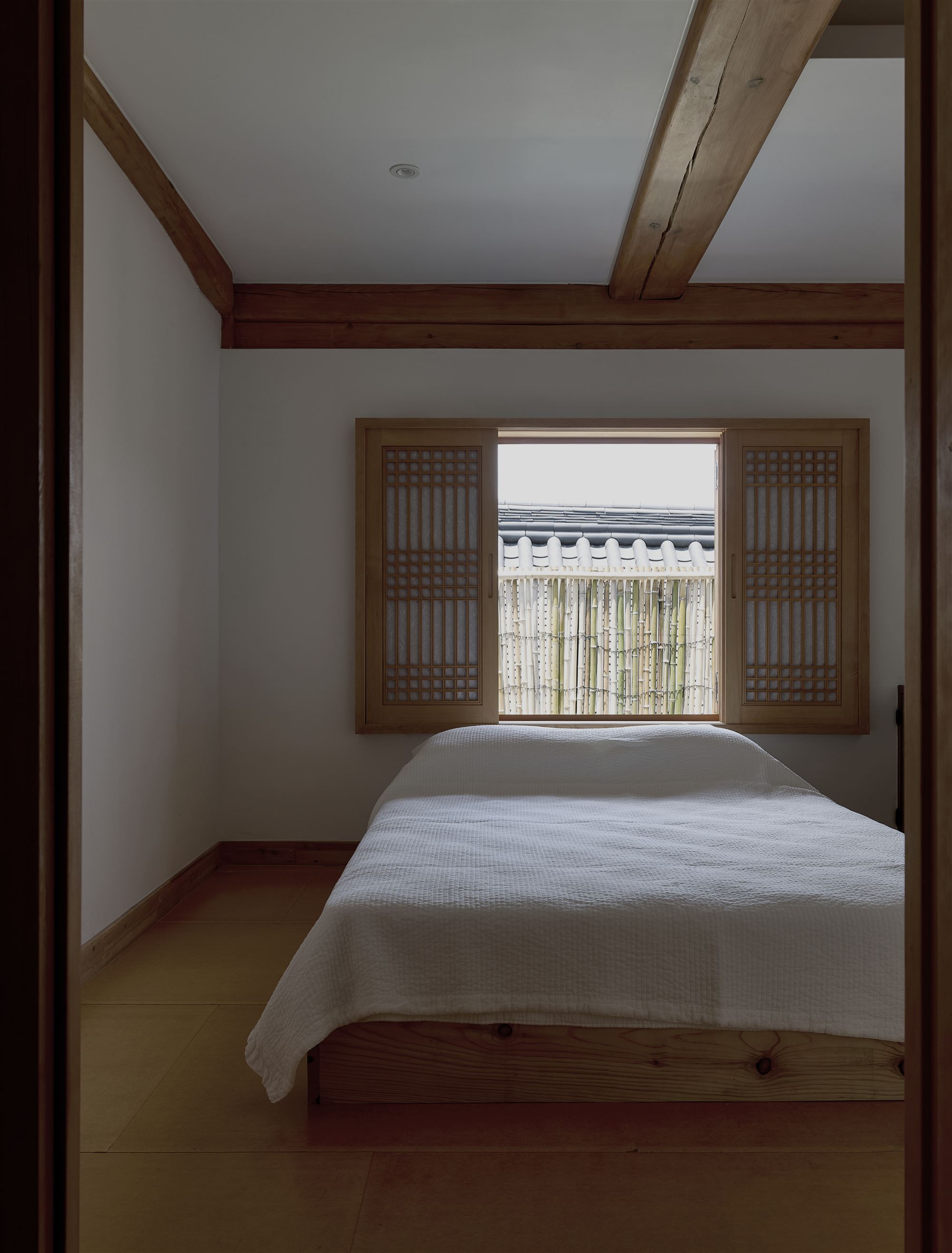 The third bedroom looking out to the bamboo fence
