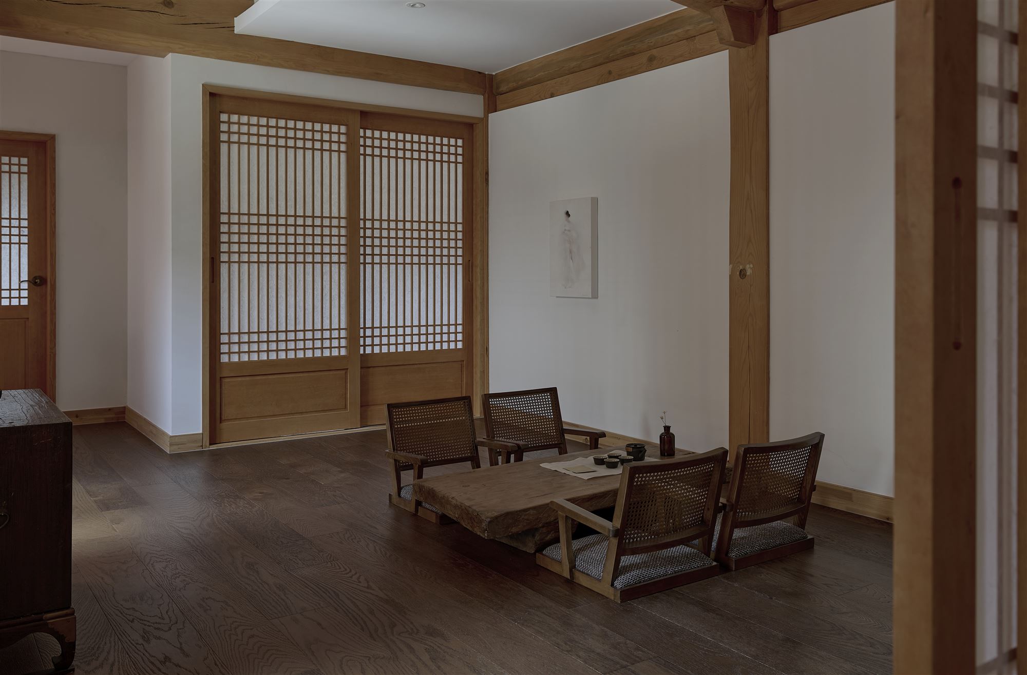 The living room with a painting and a low table