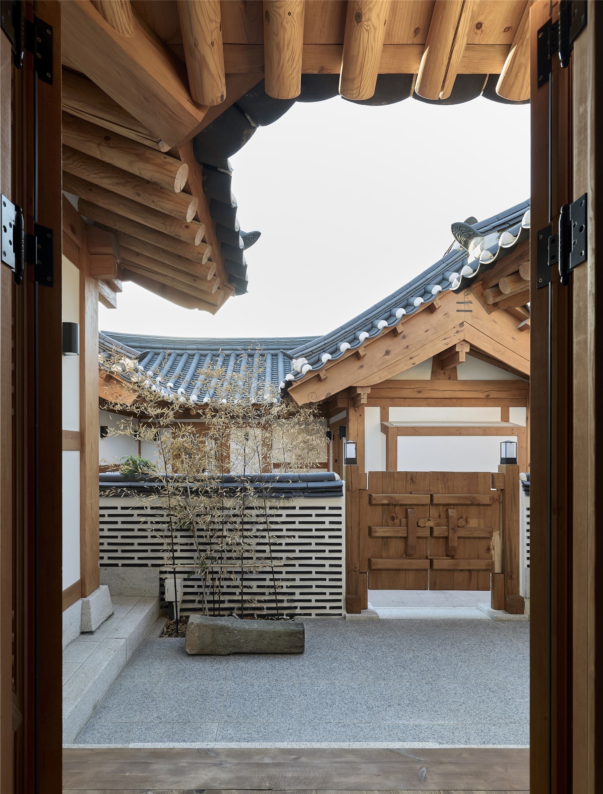 The Sarangchae courtyard with bamboo and a flat stone bench