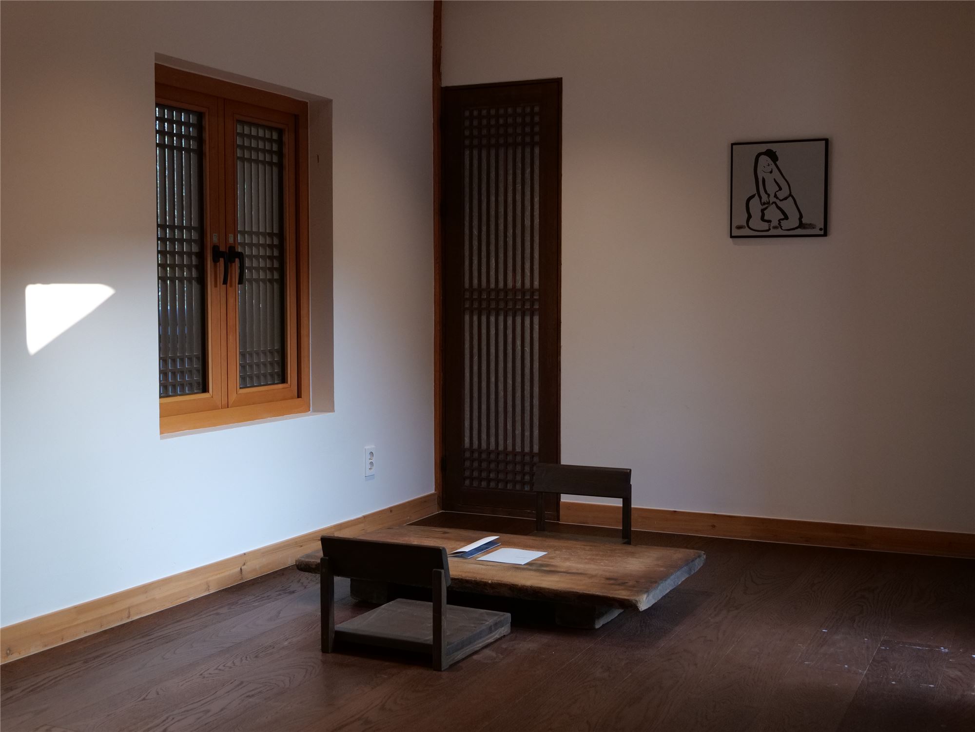A low table in the ondol room, touched by the afternoon light